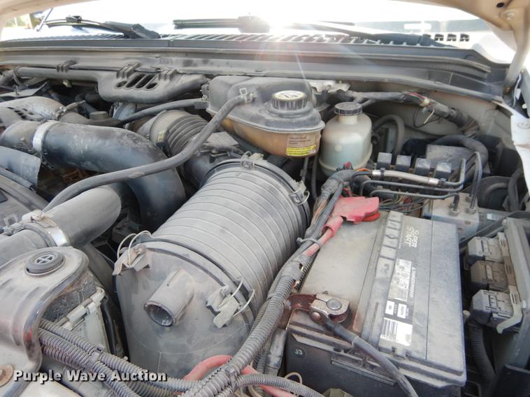 image for item DE1753 2005 Ford F350 Super Duty Crew Cab dump flatbed pickup truck