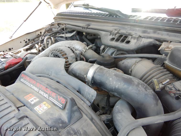 image for item DE1753 2005 Ford F350 Super Duty Crew Cab dump flatbed pickup truck