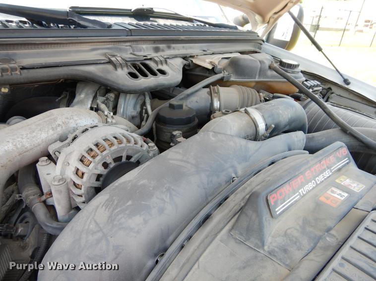 image for item DE1753 2005 Ford F350 Super Duty Crew Cab dump flatbed pickup truck