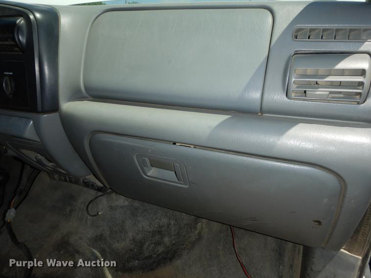 image for item DE1753 2005 Ford F350 Super Duty Crew Cab dump flatbed pickup truck