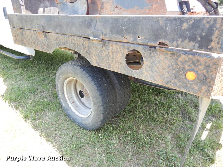 image for item DE1753 2005 Ford F350 Super Duty Crew Cab dump flatbed pickup truck