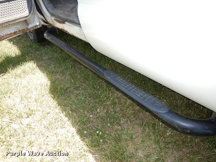 image for item DE1753 2005 Ford F350 Super Duty Crew Cab dump flatbed pickup truck