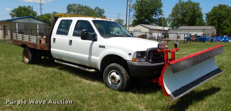 image for item DE1755 2004 Ford F350 Super Duty XL Crew Cab dump flatbed pickup truck