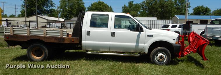 image for item DE1755 2004 Ford F350 Super Duty XL Crew Cab dump flatbed pickup truck