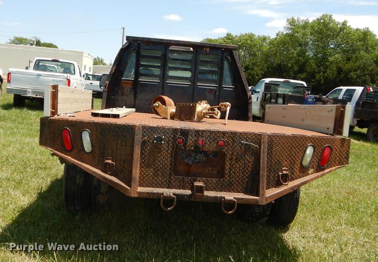 image for item DE1755 2004 Ford F350 Super Duty XL Crew Cab dump flatbed pickup truck