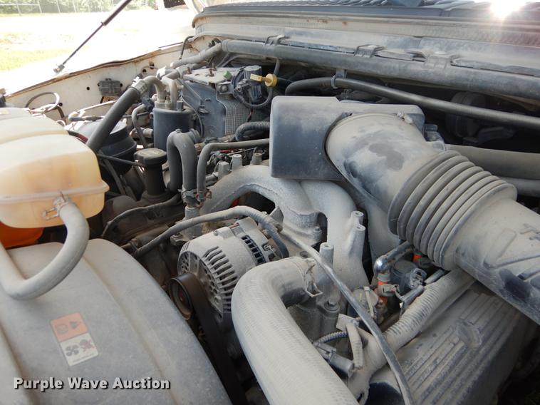 image for item DE1755 2004 Ford F350 Super Duty XL Crew Cab dump flatbed pickup truck