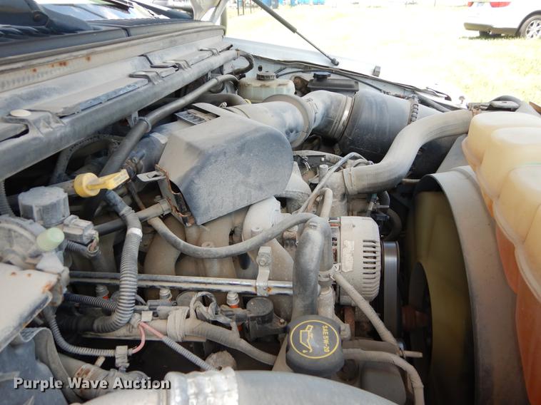 image for item DE1755 2004 Ford F350 Super Duty XL Crew Cab dump flatbed pickup truck