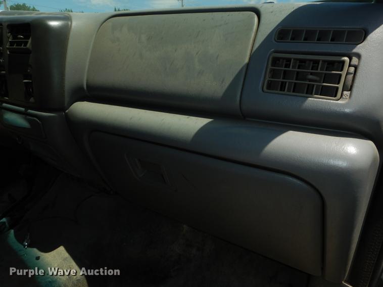 image for item DE1755 2004 Ford F350 Super Duty XL Crew Cab dump flatbed pickup truck