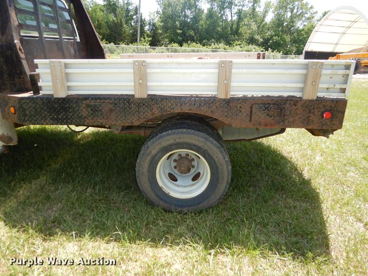 image for item DE1755 2004 Ford F350 Super Duty XL Crew Cab dump flatbed pickup truck