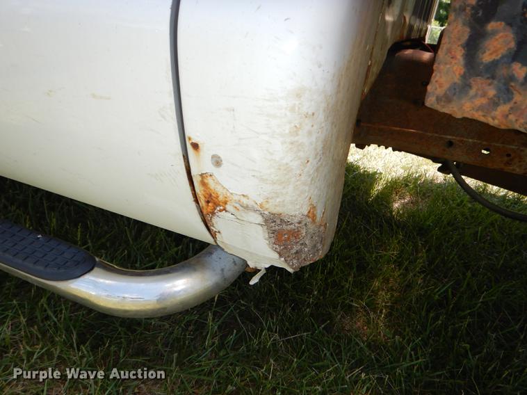 image for item DE1755 2004 Ford F350 Super Duty XL Crew Cab dump flatbed pickup truck