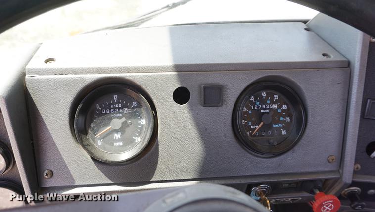 image for item DD7684 1998 Mack DM690S truck with Big John tree spade