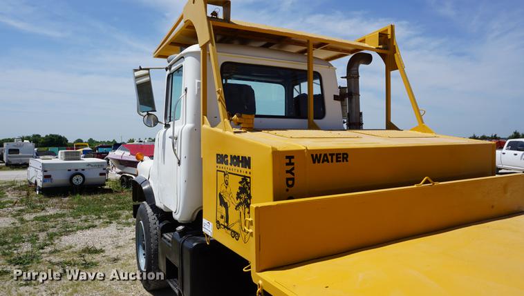 image for item DD7684 1998 Mack DM690S truck with Big John tree spade