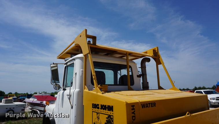 image for item DD7684 1998 Mack DM690S truck with Big John tree spade