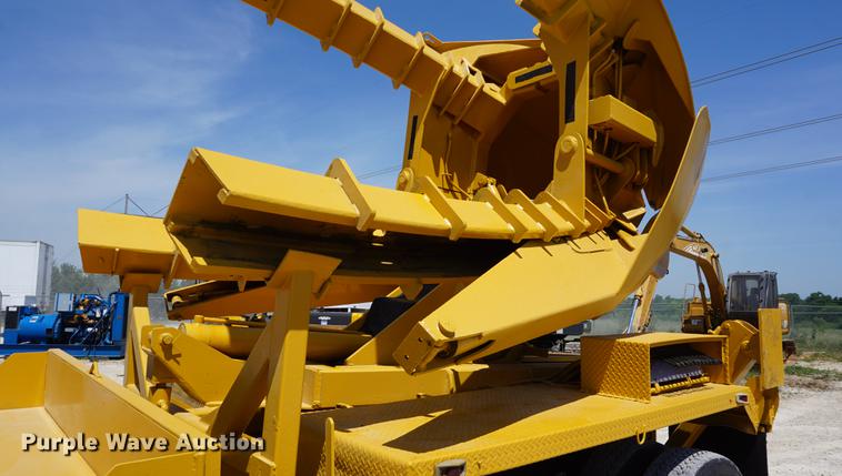 image for item DD7684 1998 Mack DM690S truck with Big John tree spade