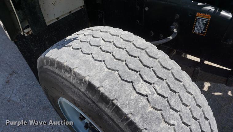 image for item DD7684 1998 Mack DM690S truck with Big John tree spade