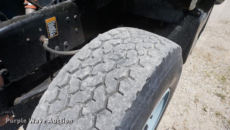 image for item DD7684 1998 Mack DM690S truck with Big John tree spade