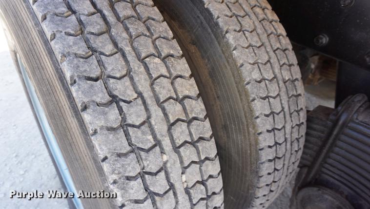 image for item DD7684 1998 Mack DM690S truck with Big John tree spade