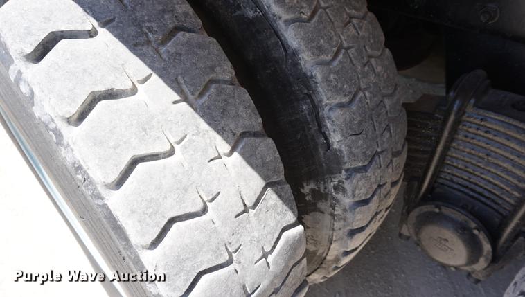 image for item DD7684 1998 Mack DM690S truck with Big John tree spade