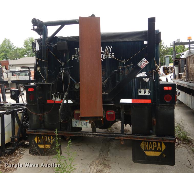 image for item DE1758 1984 Ford F700 flatbed truck with pot hole patcher