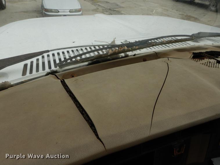 image for item DE1758 1984 Ford F700 flatbed truck with pot hole patcher