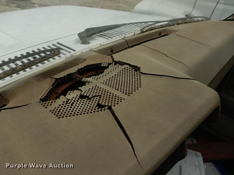 image for item DE1758 1984 Ford F700 flatbed truck with pot hole patcher