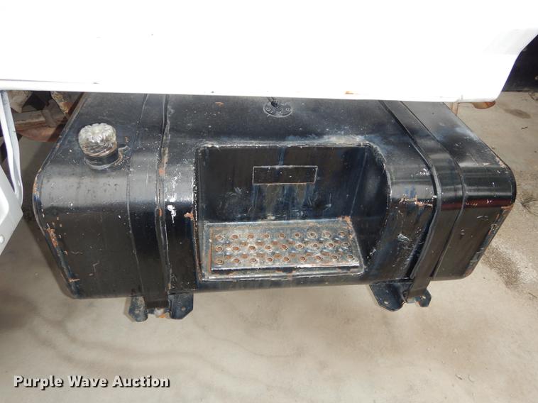 image for item DE1758 1984 Ford F700 flatbed truck with pot hole patcher