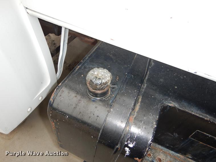 image for item DE1758 1984 Ford F700 flatbed truck with pot hole patcher