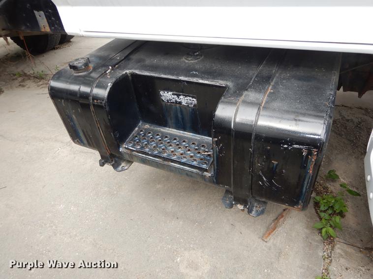 image for item DE1758 1984 Ford F700 flatbed truck with pot hole patcher