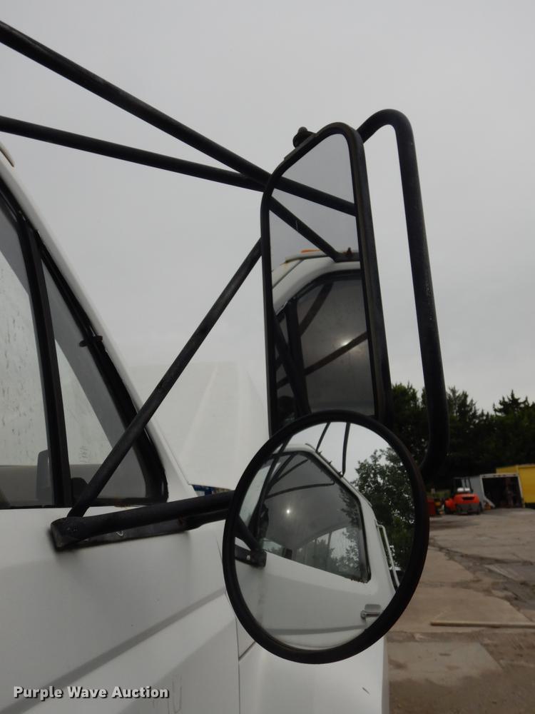 image for item DE1758 1984 Ford F700 flatbed truck with pot hole patcher