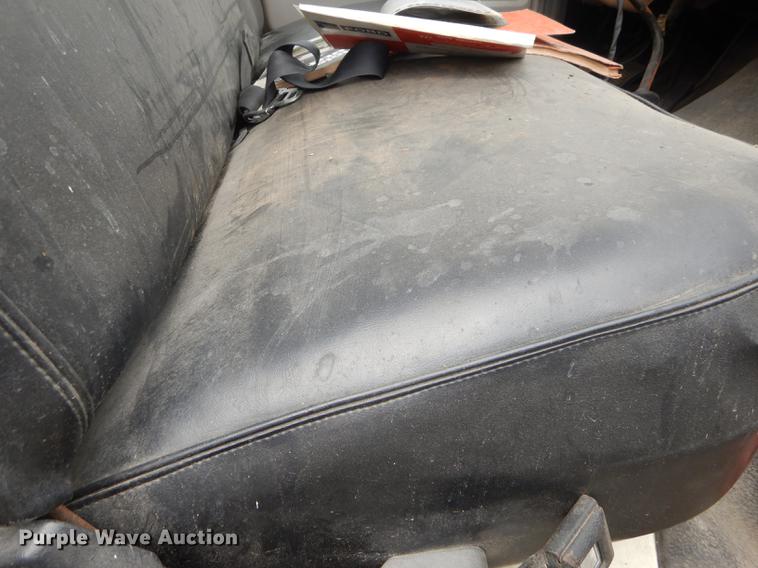 image for item DE1758 1984 Ford F700 flatbed truck with pot hole patcher