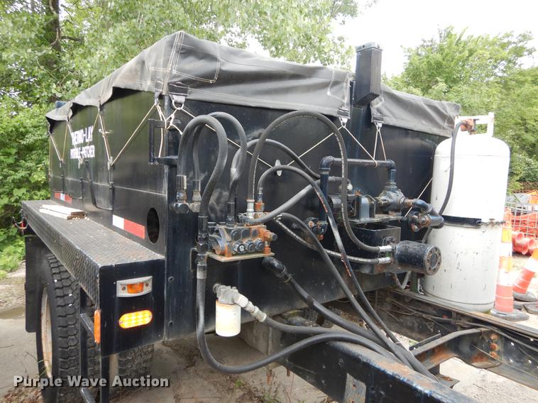 image for item DE1758 1984 Ford F700 flatbed truck with pot hole patcher