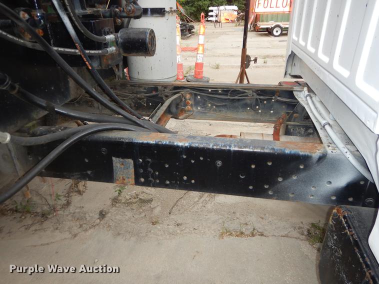 image for item DE1758 1984 Ford F700 flatbed truck with pot hole patcher