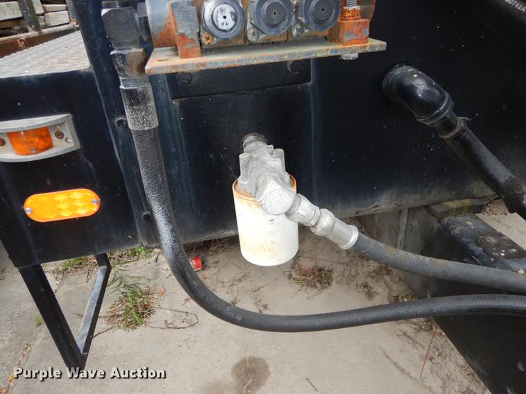 image for item DE1758 1984 Ford F700 flatbed truck with pot hole patcher