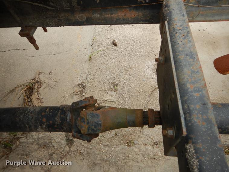 image for item DE1758 1984 Ford F700 flatbed truck with pot hole patcher