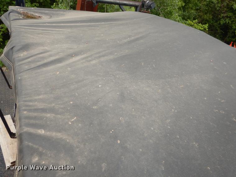 image for item DE1758 1984 Ford F700 flatbed truck with pot hole patcher