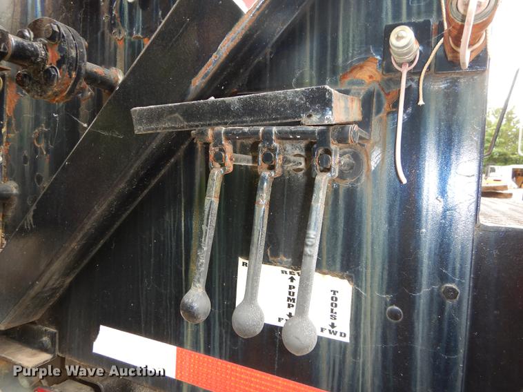 image for item DE1758 1984 Ford F700 flatbed truck with pot hole patcher