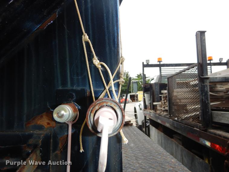 image for item DE1758 1984 Ford F700 flatbed truck with pot hole patcher