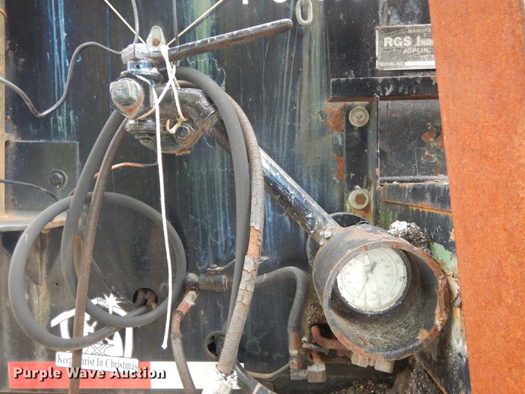 image for item DE1758 1984 Ford F700 flatbed truck with pot hole patcher