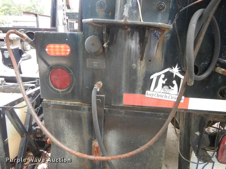 image for item DE1758 1984 Ford F700 flatbed truck with pot hole patcher