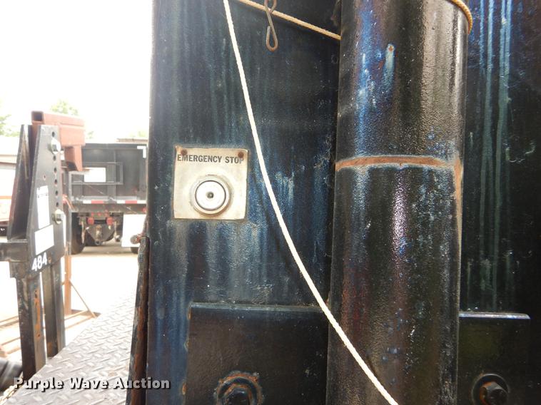 image for item DE1758 1984 Ford F700 flatbed truck with pot hole patcher