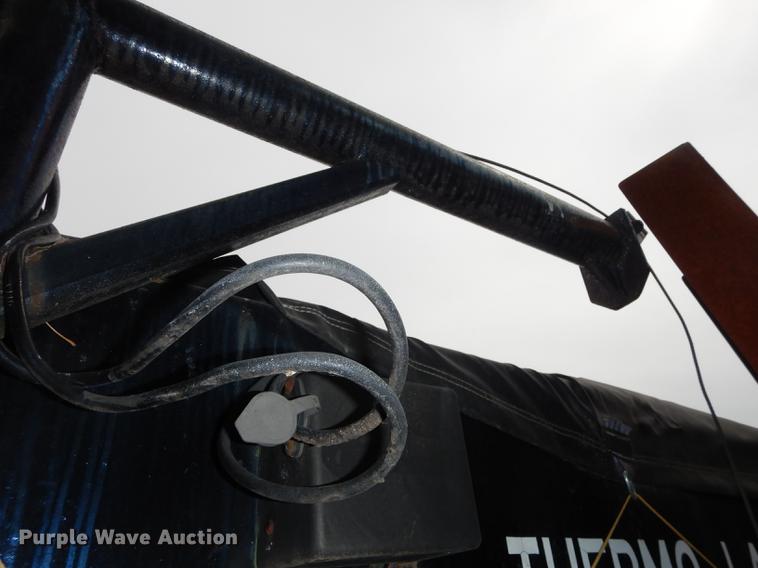 image for item DE1758 1984 Ford F700 flatbed truck with pot hole patcher