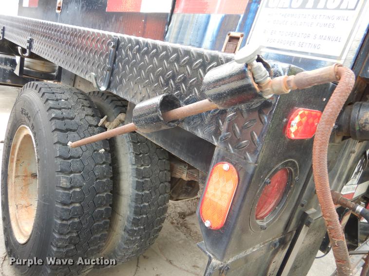 image for item DE1758 1984 Ford F700 flatbed truck with pot hole patcher