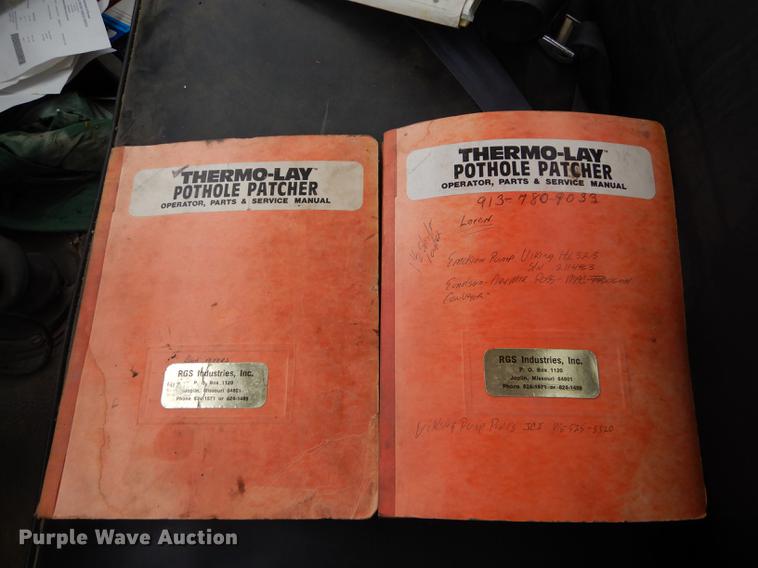 image for item DE1758 1984 Ford F700 flatbed truck with pot hole patcher