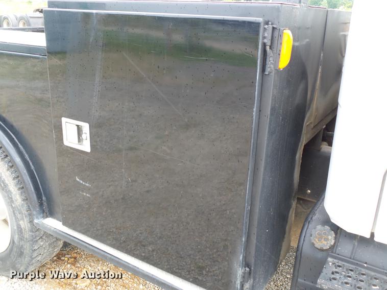 image for item DB7114 2004 Freightliner FL70 flatbed truck