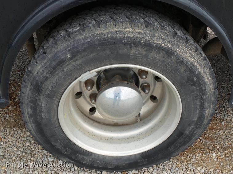 image for item DB7114 2004 Freightliner FL70 flatbed truck