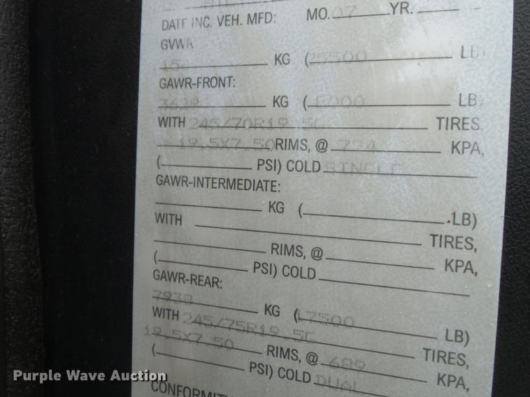 image for item DB7114 2004 Freightliner FL70 flatbed truck