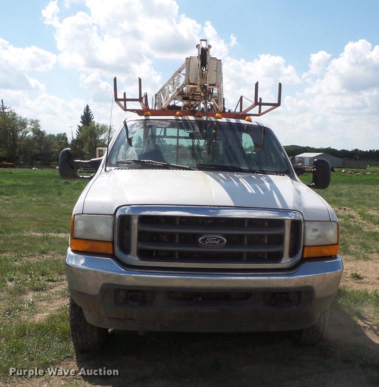 image for item DC4718 2001 Ford F350 Super Duty utility bed pickup truck with Jessen pump hoist