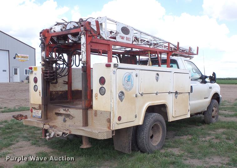 image for item DC4718 2001 Ford F350 Super Duty utility bed pickup truck with Jessen pump hoist