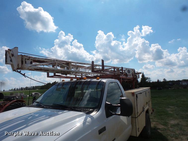 image for item DC4718 2001 Ford F350 Super Duty utility bed pickup truck with Jessen pump hoist