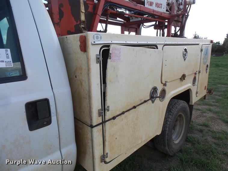 image for item DC4718 2001 Ford F350 Super Duty utility bed pickup truck with Jessen pump hoist